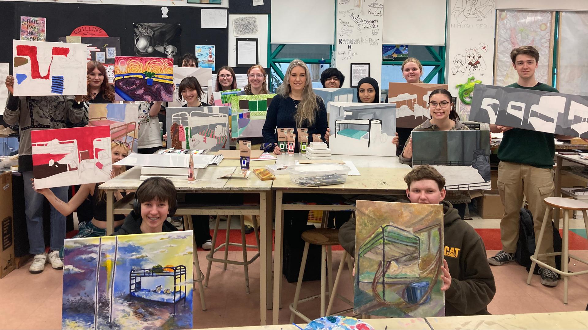 St. Pius X's students showing their artwork