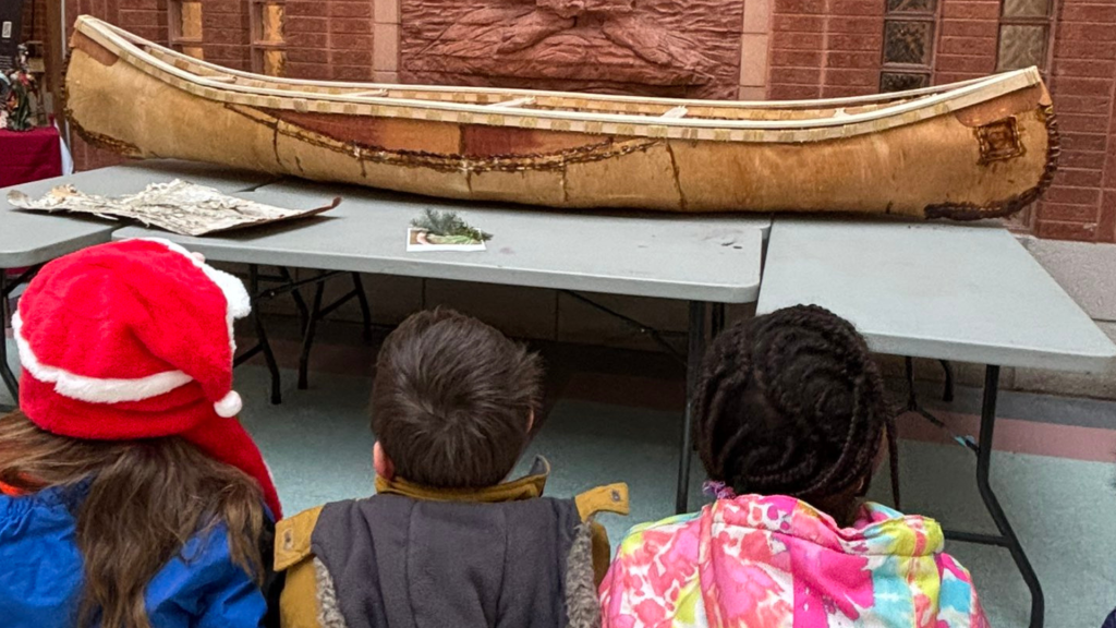 Students learning about building a traditional Canoe