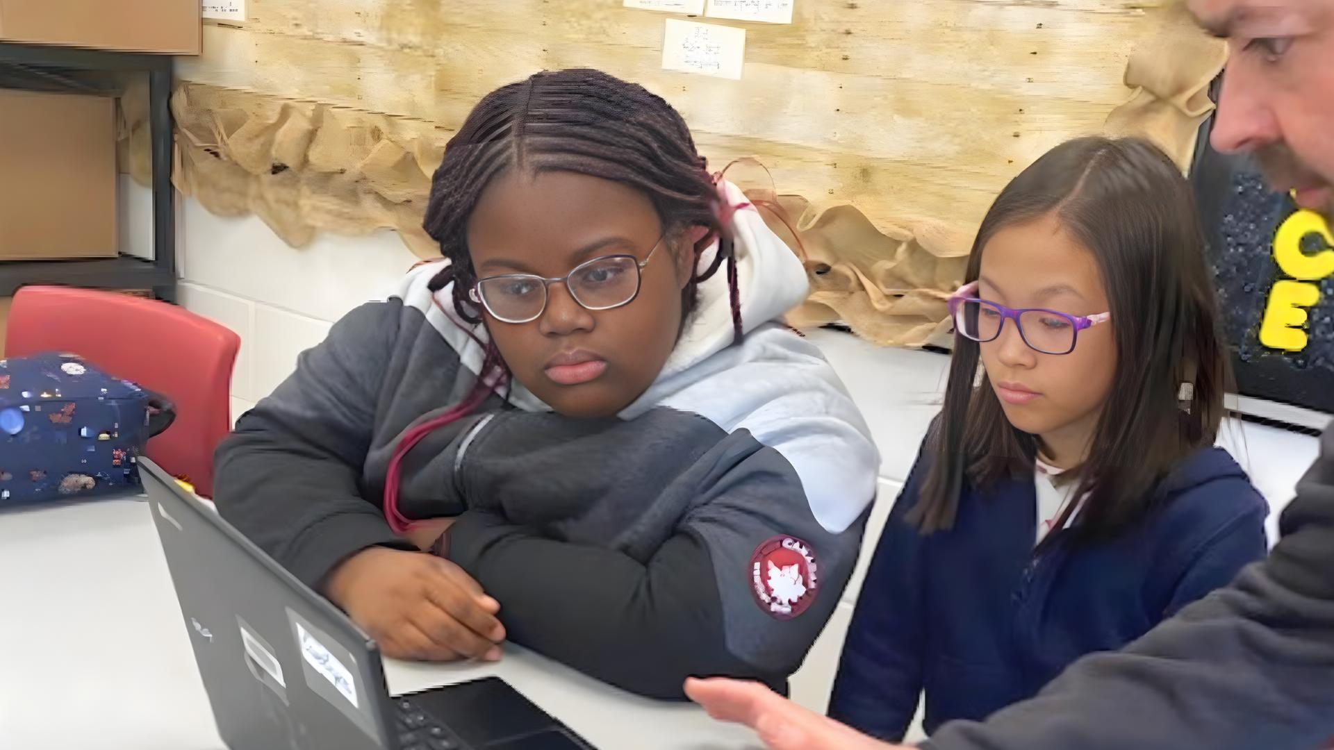 Gifted Learners work on the AI project with their instructor