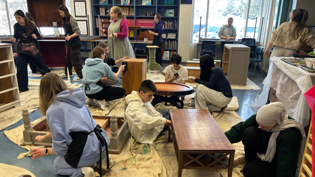 Students at All Saints dive into an upcycling project, turning old materials into something new in their classroom