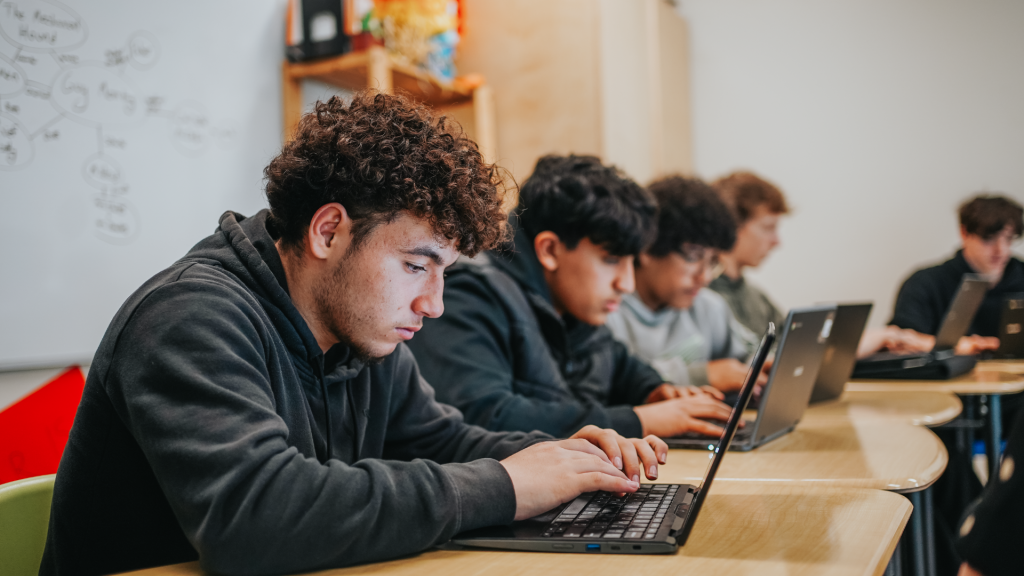 Students exploring BriskBoost AI in their classroom