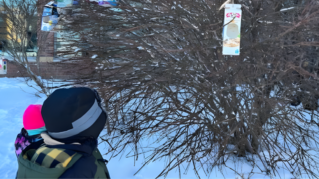 Guardian Angels' student admiring the bird sanctuary that they made