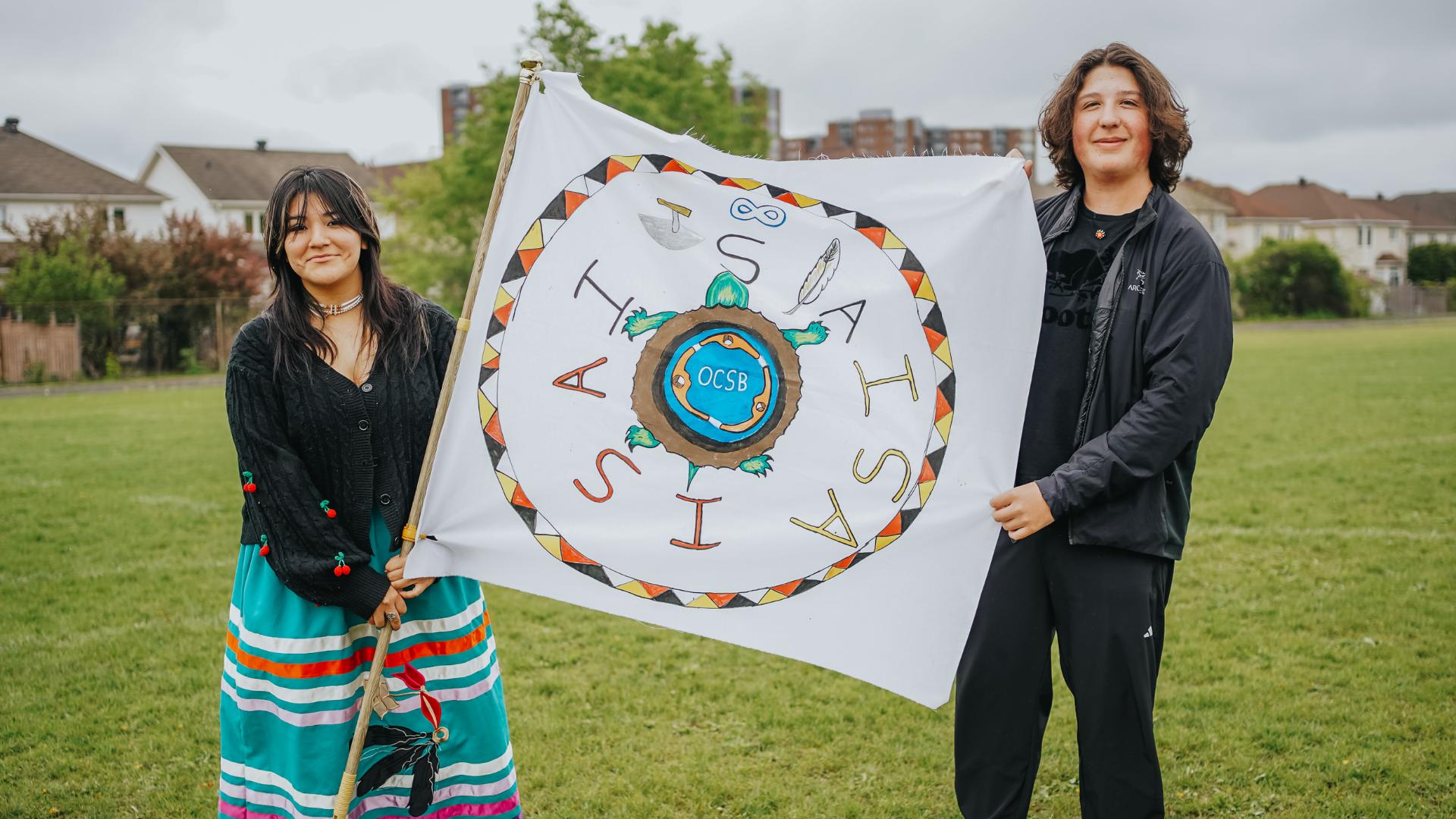 Students holding the AISA Flag