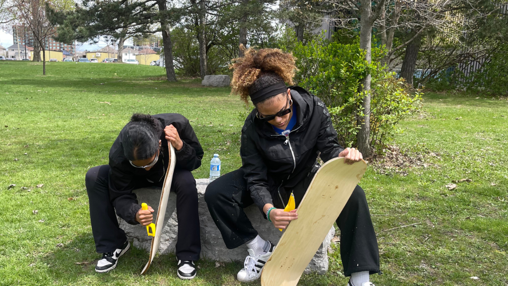 OCSB students working on their skateboard outdoors