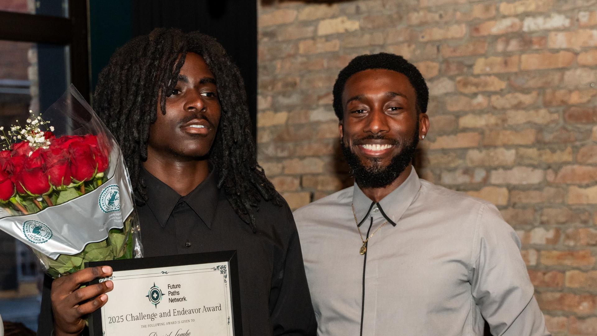 Tolo Akinrinola with an awarded student ceremony