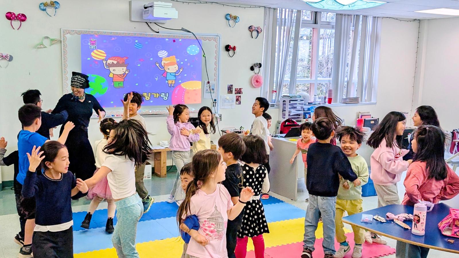 students singing and dancing during a class activity