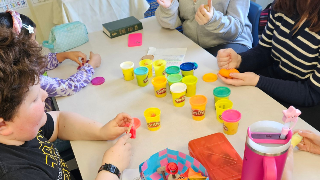 Children working with playdoh in a classroom activity
