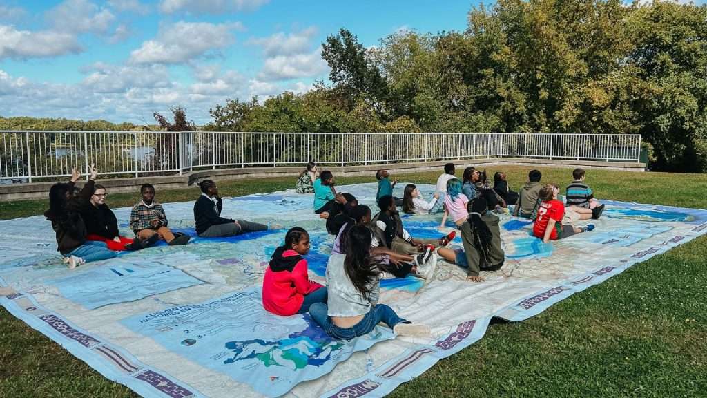 Students experiments the Great Lakes Interactive Map outdoors
