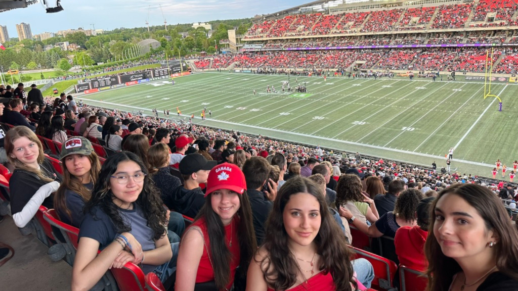 OCSB international students attending an Ottawa REDBLACKS football game