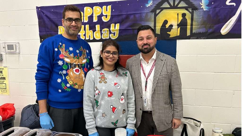 St Rose of Lima school family at their food table during Christmas event