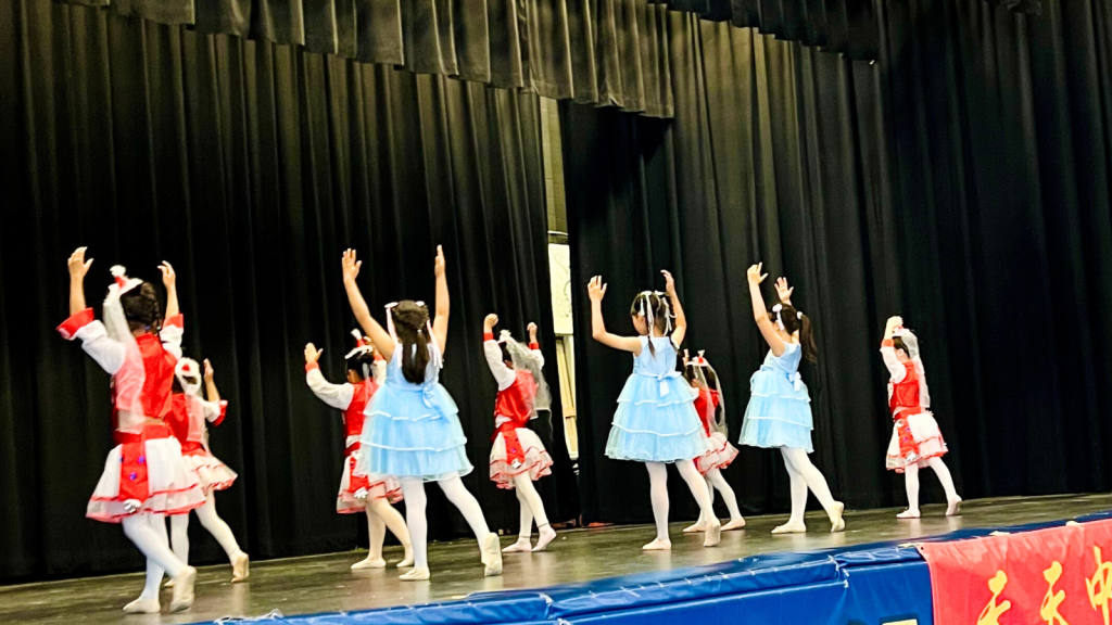 International language program students presenting a dance on the stage