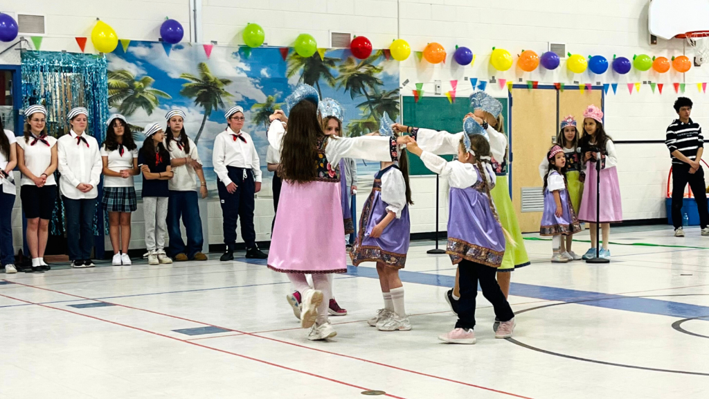 Language learners dancing in a school activity