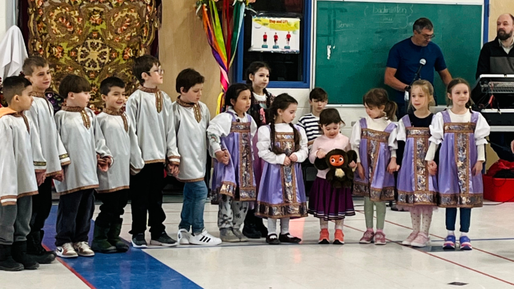 Language education learners presenting to the school