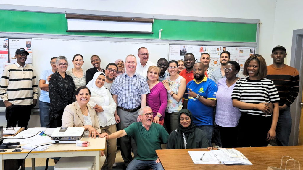 Adult graduates in their classroom