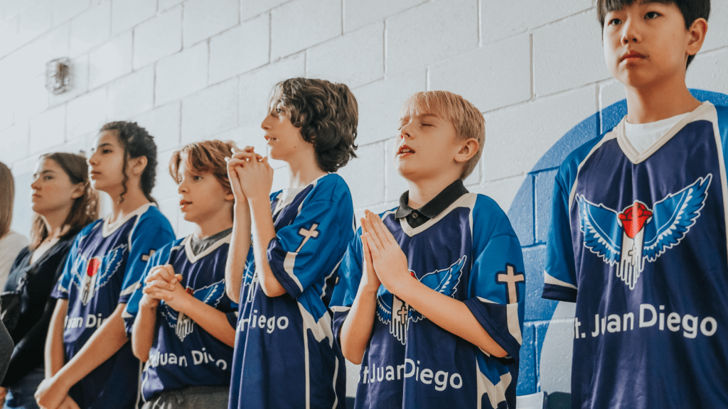 St. Juan School's students praying during the school blessing ceremony