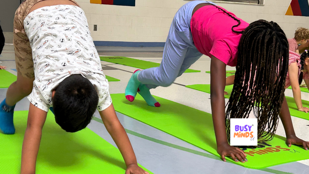 Camp participants during a yoga class with Busy Minds
