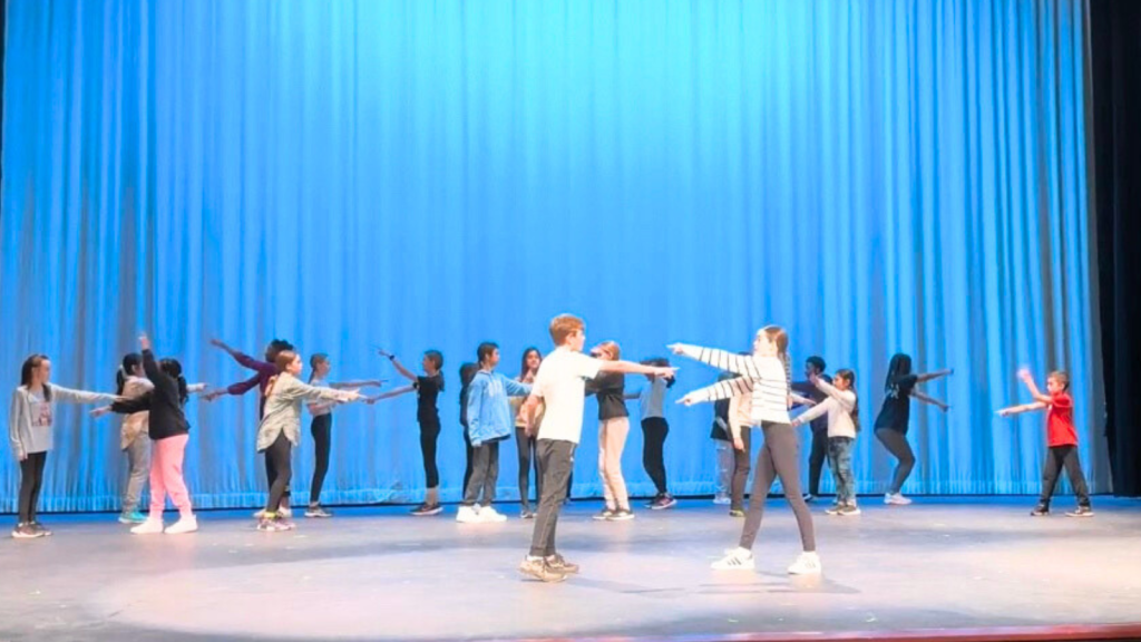 OCSB campers dancing on the stage