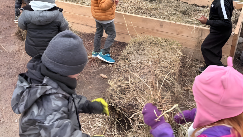 Guardian Angels School children working on a birds sanctuary