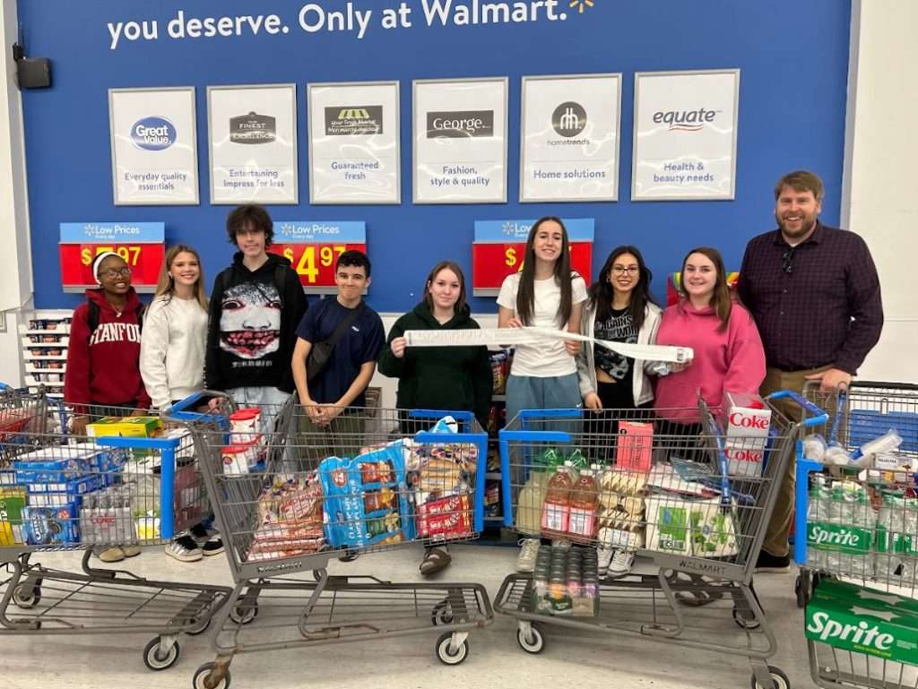 Sacred Heart students purchasing food to donate to Stittsville Food Bank