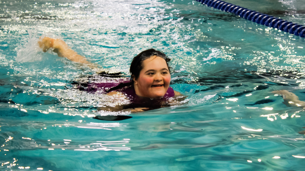 student swimming at the Annual Swim Meet