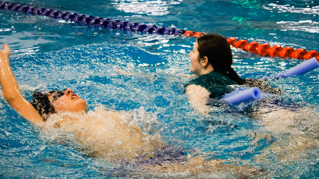 students swimming at the Annual Swim Meet