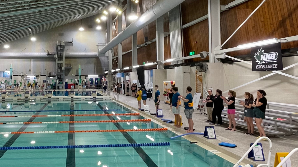 Students ready to jump and compete during the Annual Swim Meet