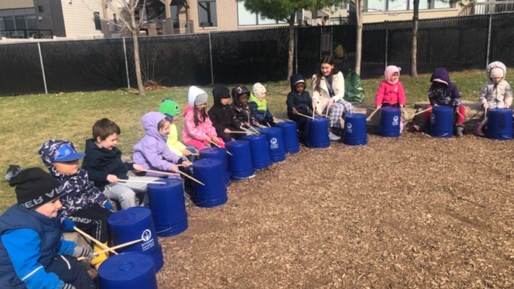 St. Anne's students practicing music and rhythm outdoors