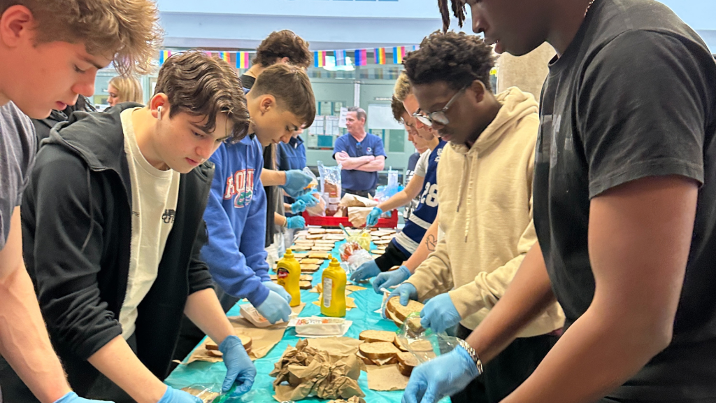All Saints' students making sandwiches to donate