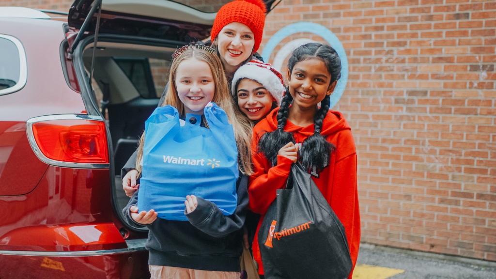 Students and teacher organizing the donation bags